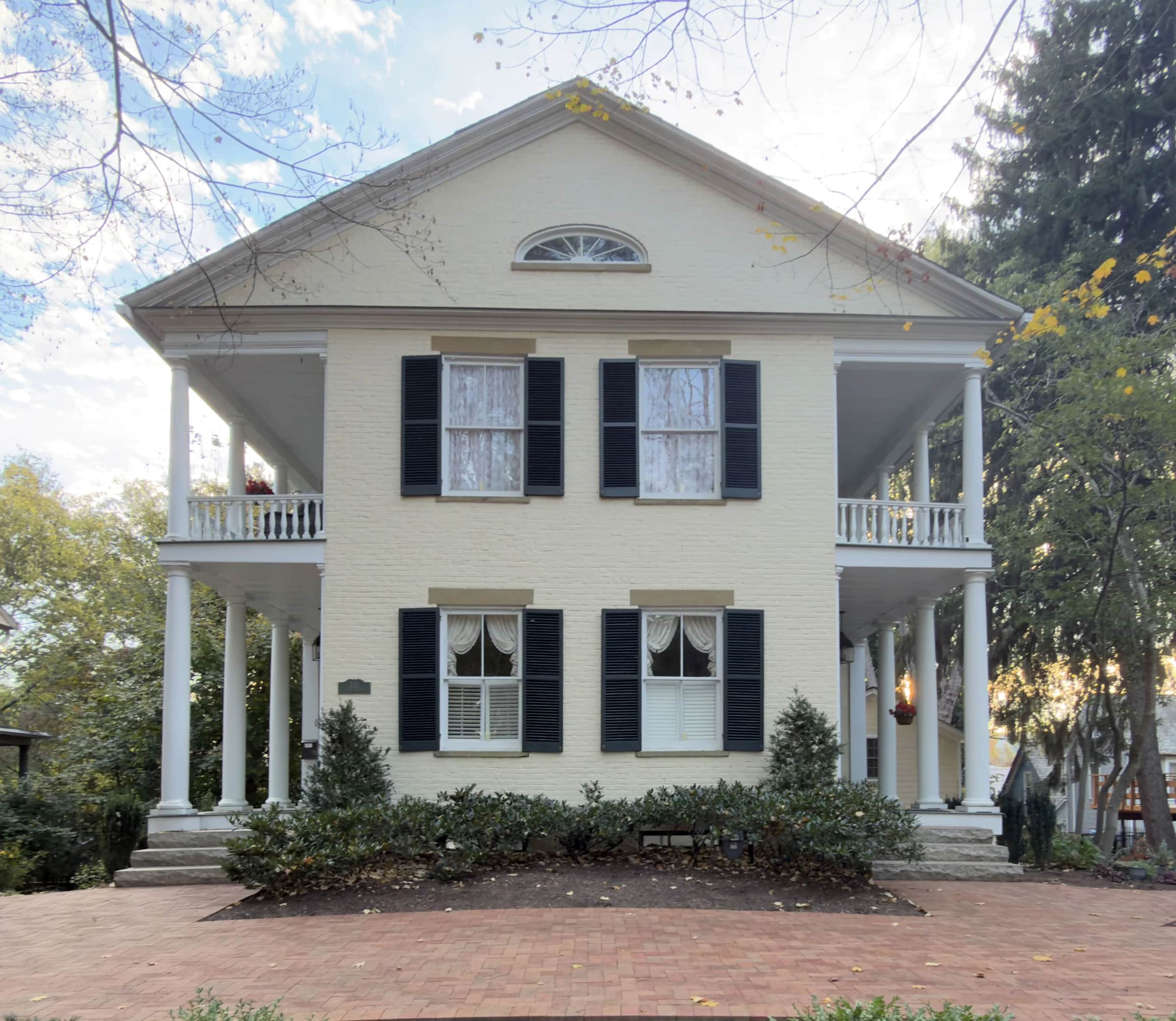 Straight-on daylight view of the symmetrical house facade